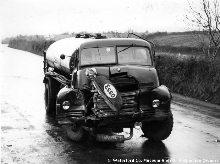 Description A badly damaged Esso oil truck after a crash at an unknown